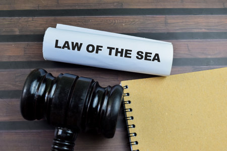 Law of the Sea text on Document and Gavel isolated on office desk. Justice law conceptの写真素材