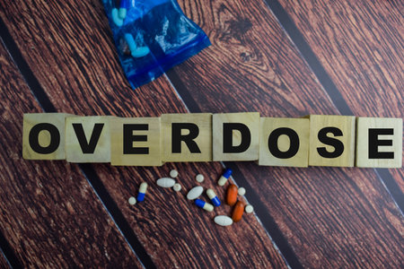 Concept of The wooden Cubes with the word Overdose on wooden background.の写真素材