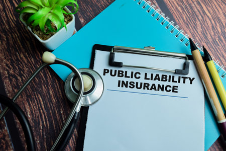 Concept of Public Liability Insurance write on paperwork with stethoscope isolated on wooden background.の写真素材
