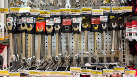 shelf with power tools in the store. Necessary tools for small repairs in everyday life. Bekasi,...