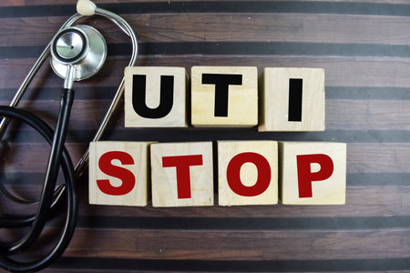Concept of The wooden Cubes with the word Uti Stop on wooden background.