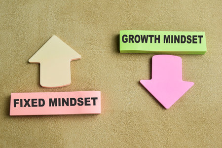 Concept of Fixed Mindset or Growth Mindset write on sticky notes isolated on Wooden Table.の写真素材