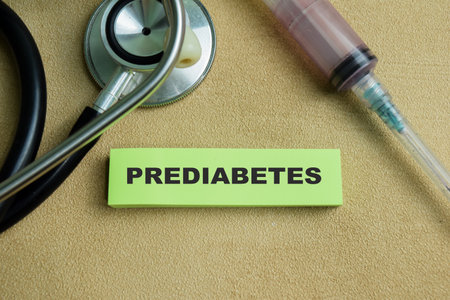 Concept of Prediabetes write on sticky notes isolated on Wooden Table.