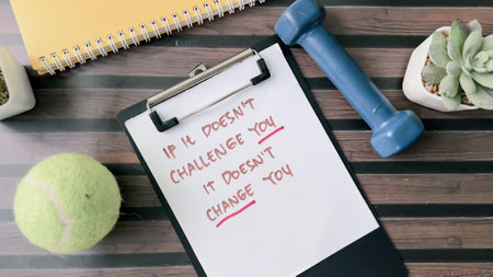 Concept of It it Doesn't Challenge You, It Doesn't Change You write on paperwork isolated on wooden background.の写真素材