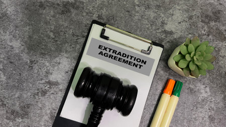 Concept of Extradition agreement write on paperwork isolated on wooden background.の写真素材