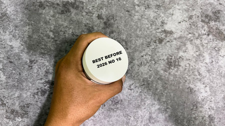 Close up text best before date on bottle cap food