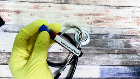 Lead Level Test text with blood sample. Top view isolated on black background. Healthcare/Medical conceptの写真素材