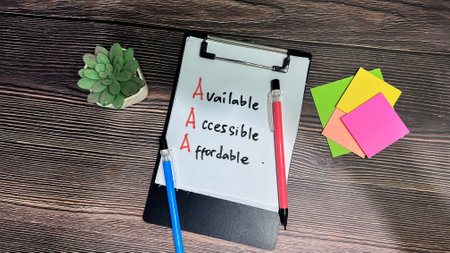 Concept of AAA - Available, Accessible, Affordable write on paperwork isolated on wooden background.の写真素材