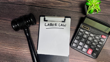 Concept of Labor Law write on paperwork isolated on wooden background.の写真素材