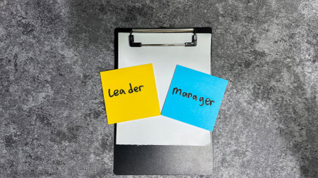Concept of Leader vs Manager write on sticky notes.の写真素材