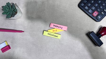 Concept of Diversity and Inclusion write on sticky notes isolated on Wooden Table.の写真素材
