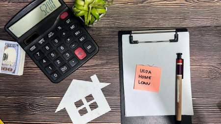 Concept of Home Loan write on sticky notes isolated on Wooden Table.の写真素材