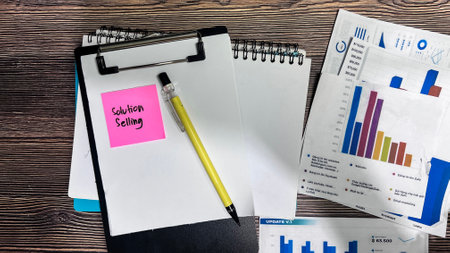 Concept of Solution Selling write on sticky notes isolated on Wooden Table.の写真素材