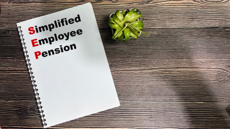 Concept of SEP - Simplified Employee Pension write on book isolated on Wooden Table.の写真素材