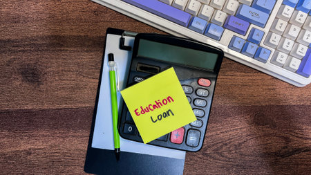 Concept of Education Loan write on sticky notes isolated on Wooden Table.の写真素材