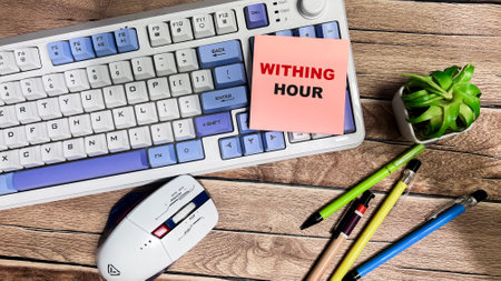 Concept of Within Hour write on sticky notes isolated on Wooden Table.の写真素材
