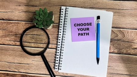 Concept of Choose Your Path write on sticky notes isolated on Wooden Table.の写真素材