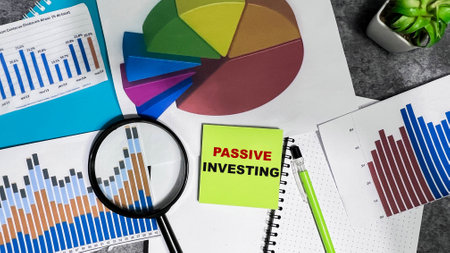 Concept of Passive Investing write on sticky notes isolated on Wooden Table.の写真素材