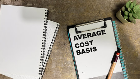 Concept of Average Cost Basis write on paperwork isolated on Wooden Table.の写真素材