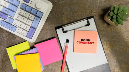 Concept of Bond Covenant write on sticky notes isolated on Wooden Table.の写真素材