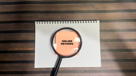 Concept of Online Reviews write on sticky notes isolated on Wooden Table.の写真素材