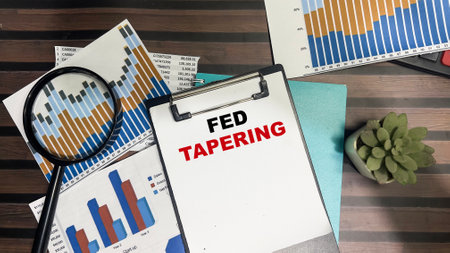 Concept of Fed Tapering write on paperwork isolated on Wooden Table.の写真素材