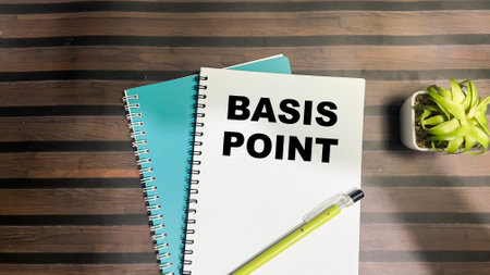 Concept of Basis Point write on book isolated on Wooden Table.の写真素材