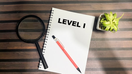 Concept of Level 1 write on book isolated on Wooden Table.の写真素材