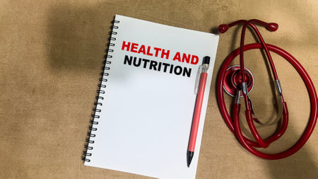 Concept of Health and Nutrition write on book isolated on Wooden Table.の写真素材