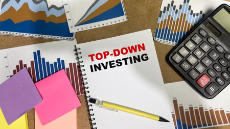 Concept of Top-Down Investing write on book isolated on Wooden Table.の写真素材