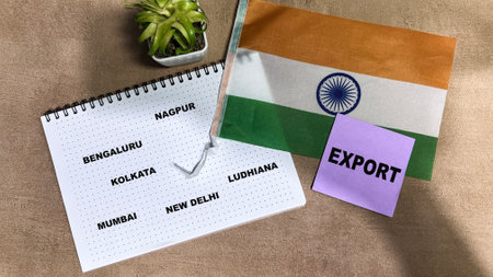 Concept of Export write on sticky notes and Flag of the India isolated on Wooden Table.