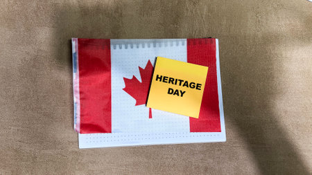 Concept of Heritage Day write on sticky notes and Flag of Canada on Wooden Table.の写真素材