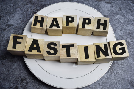 The word Happy fasting in wooden block. Fasting concept illustrationの写真素材