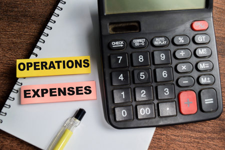 Concept of Operations Expenses write on sticky notes isolated on Wooden Table.の写真素材
