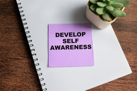 Concept of Develop Self Awareness write on sticky notes isolated on Wooden Table.の写真素材
