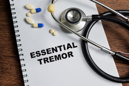 Concept of Essential Tremor write on book isolated on Wooden Table.の写真素材