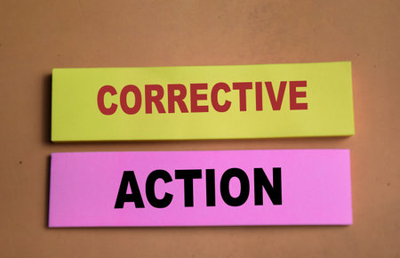 Concept of Corrective Action write on sticky notes isolated on Wooden Table.の写真素材