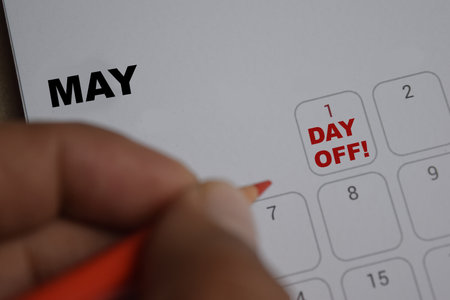 May 1. writing text Day Off on calendar date. Save the date. Day of the year concept.
