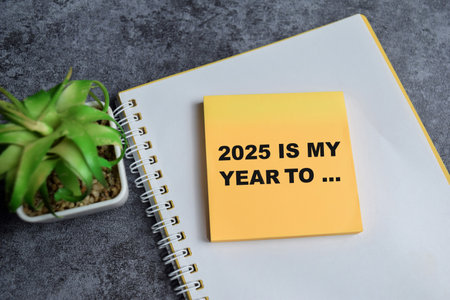 Concept of 2025 is my year to write on sticky notes isolated on Wooden Table.