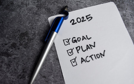 Concept of Checklist for 2025 Goals, plan, action with check marks write on paperwork isolated on...