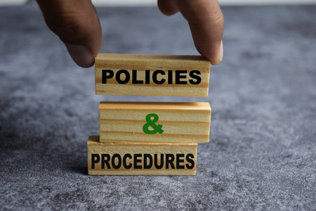 Concept of Policies and Procedures Symbol. Wooden block with words Policies and Procedures