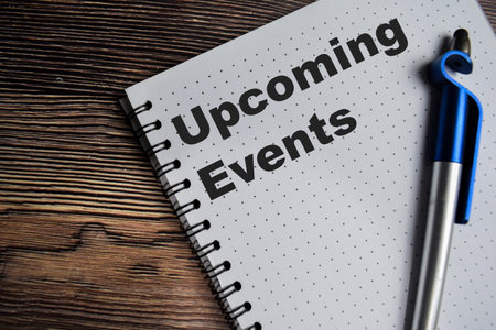Concept of upcoming events on book isolated on Wooden Table.の写真素材