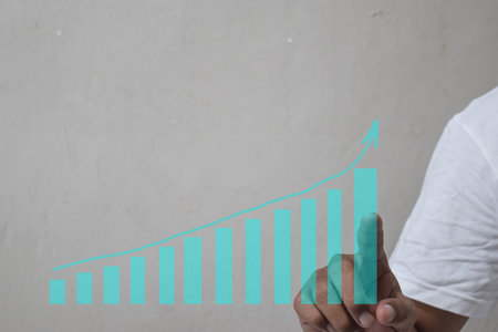Businessman to touch in peak of business graph on abstract. Concept financial symbols coming success and profitabilityの写真素材