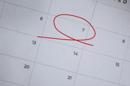 Focus on number 7 in calendar and emptyred ellipse. Save the date. Day of the year concept.の写真素材