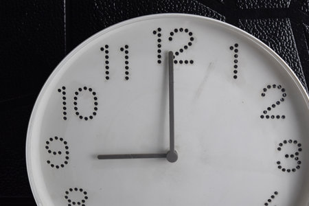 Focus time in clock of nine o'clock for design in your business concept isolated on black backgroundの写真素材