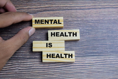 Concept of mental health is health Symbol. Wooden block with words mental health is healthの写真素材