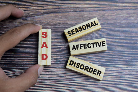Concept of SAD - seasonal affective disorder Symbol. Wooden block with words SAD - seasonal affective disorderの写真素材