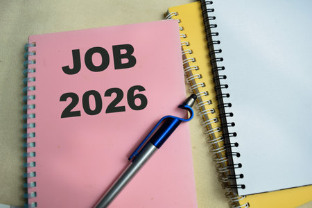 Concept of Job 2026 write on book isolated on Wooden Table.の写真素材