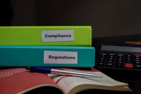 folders with the label Compliance and Regulations. Business management conceptの写真素材