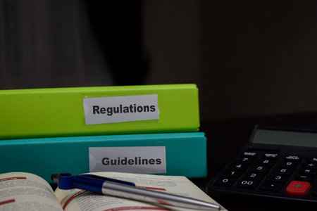 folders with the label Regulations and Guidelines. Business management conceptの写真素材